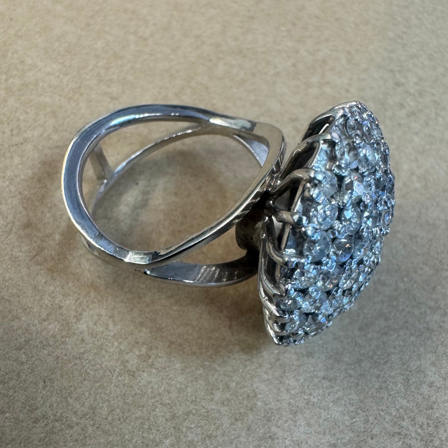 18K gold ring set with Diamonds in a bold pavé setting.