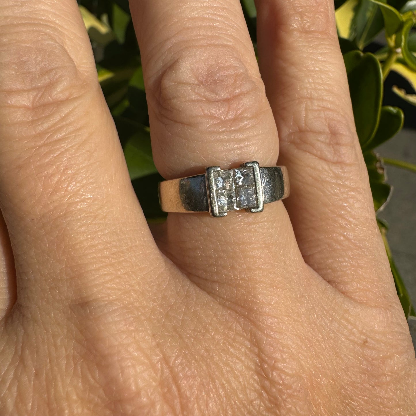 14K gold ring set with 4 square-cut Diamonds