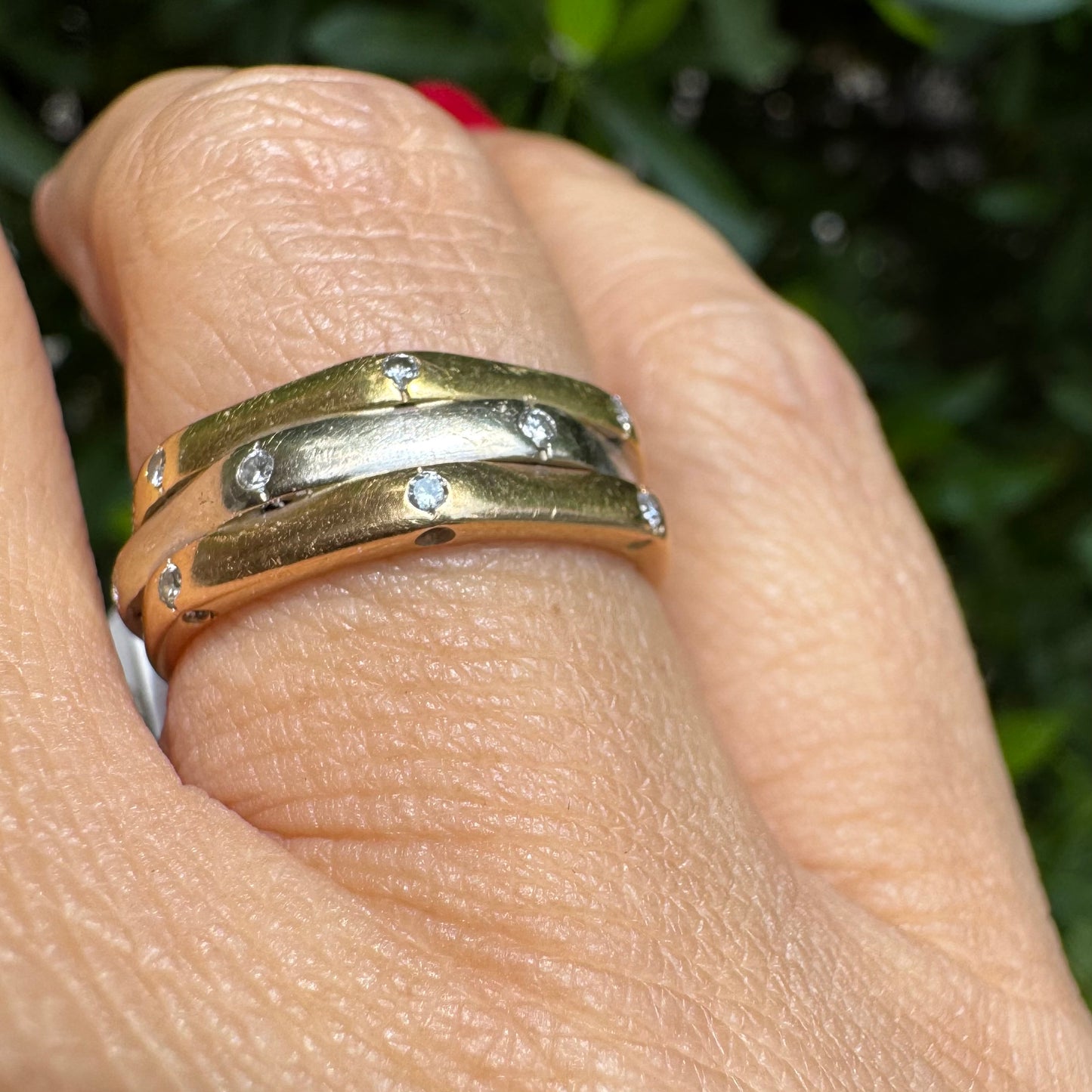 18K gold ring crafted in yellow, white, and rose gold, featuring a triple-band design set with Diamonds