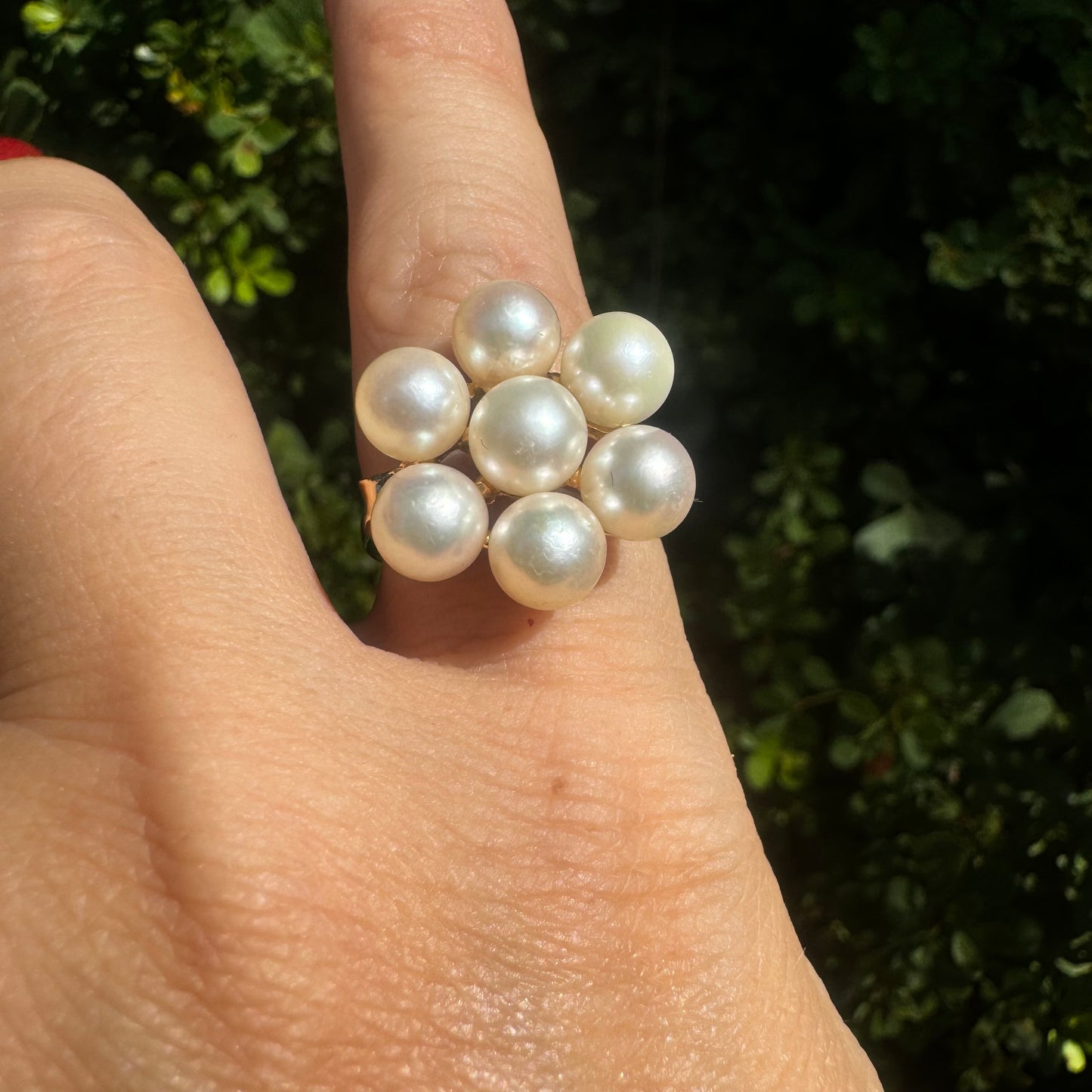 14K gold ring set with seven round Pearls in a bold floral cluster
