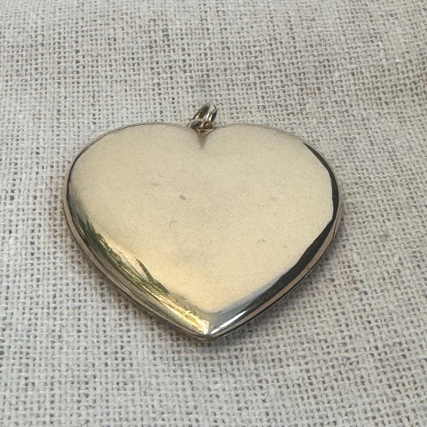 14K gold heart locket in smooth, polished gold tone