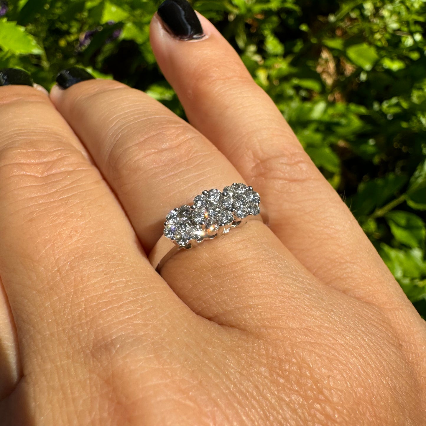 14K white gold ring set with clusters of brilliant white Diamonds