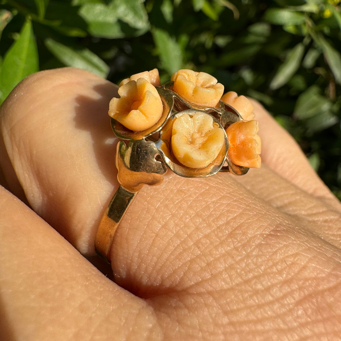 9K gold ring featuring a cluster design with carved Coral flowers in warm orange tones