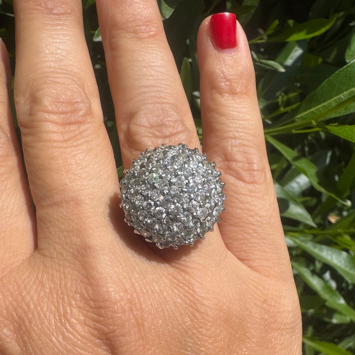 18K gold ring set with Diamonds in a bold pavé setting.