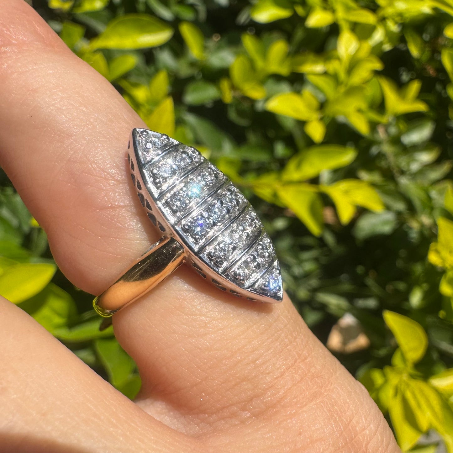 18K gold marquise-shaped ring set with multiple rows of sparkling Diamonds