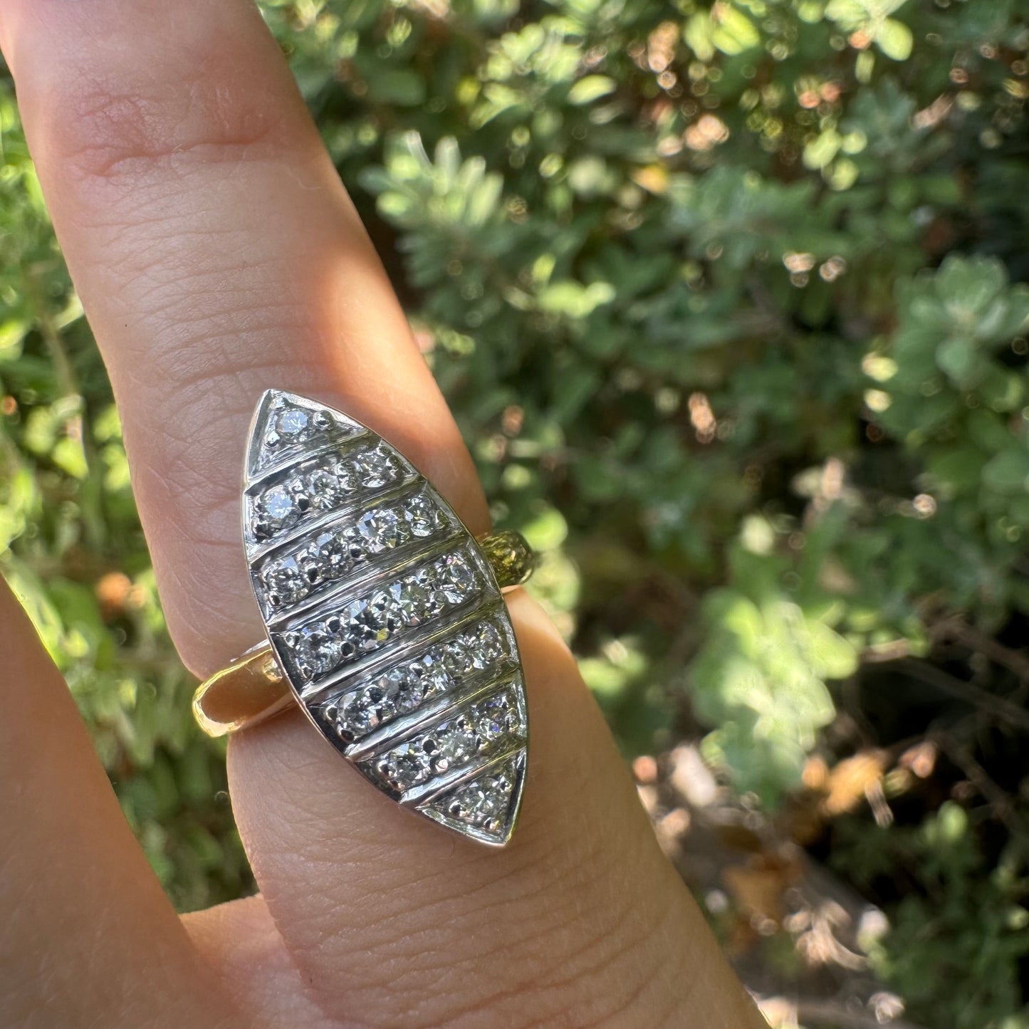 18K gold marquise-shaped ring set with multiple rows of sparkling Diamonds