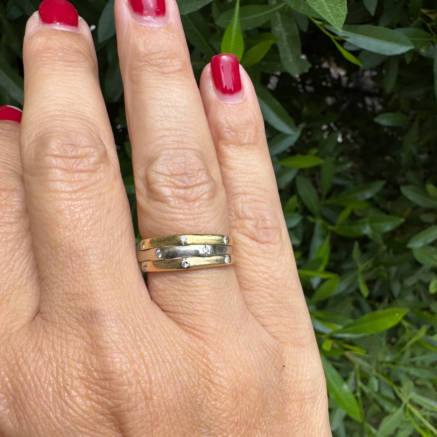 18K gold ring crafted in yellow, white, and rose gold, featuring a triple-band design set with Diamonds