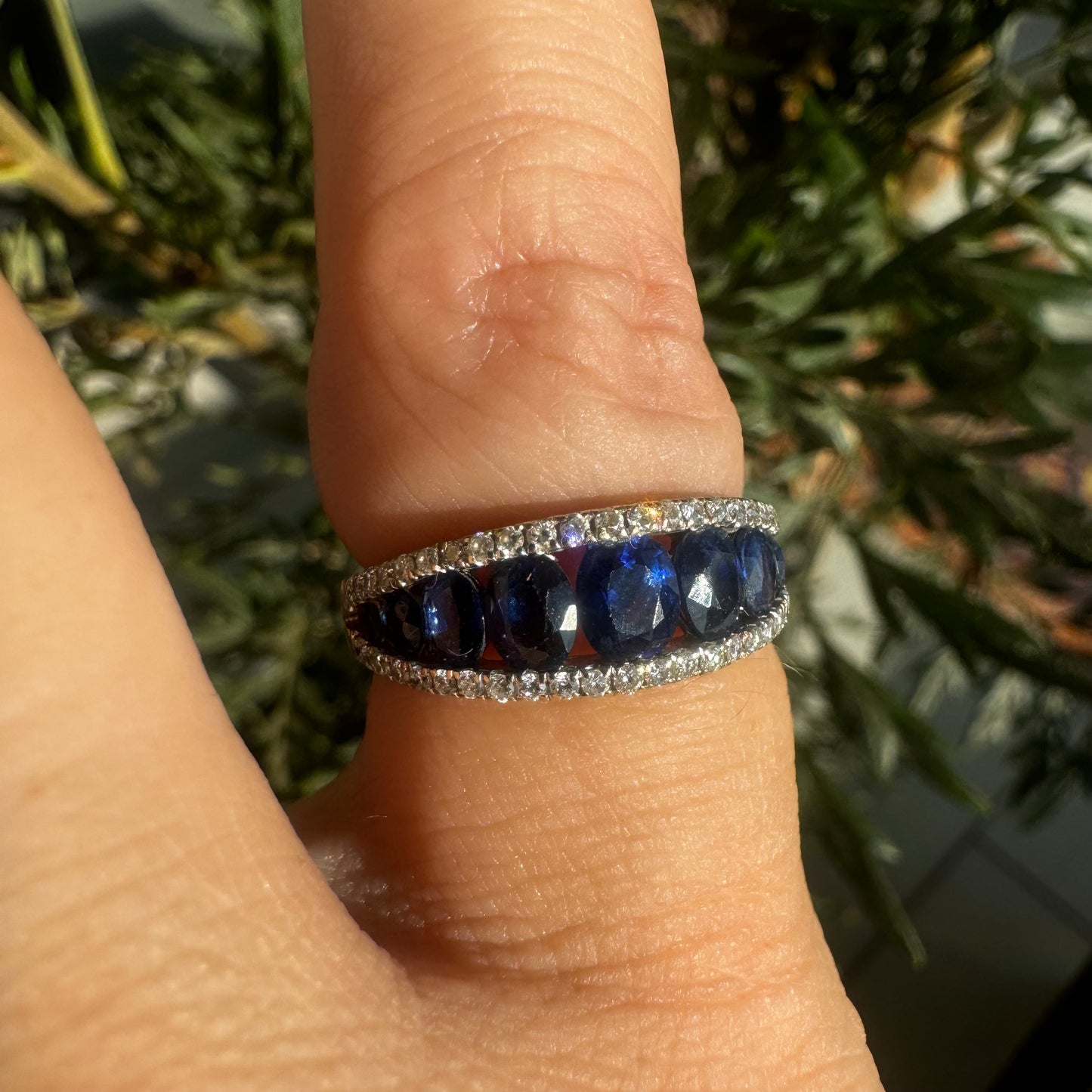 18K gold ring set with a row of deep blue Sapphire & Diamonds