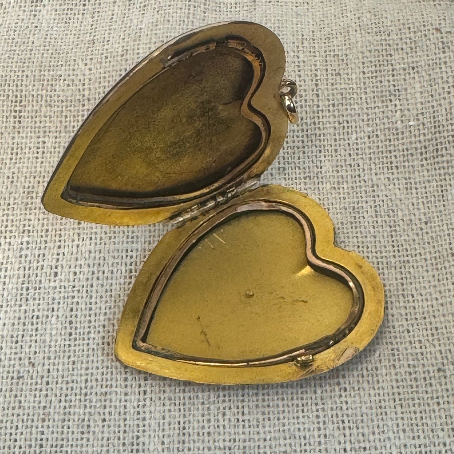 14K gold heart locket in smooth, polished gold tone