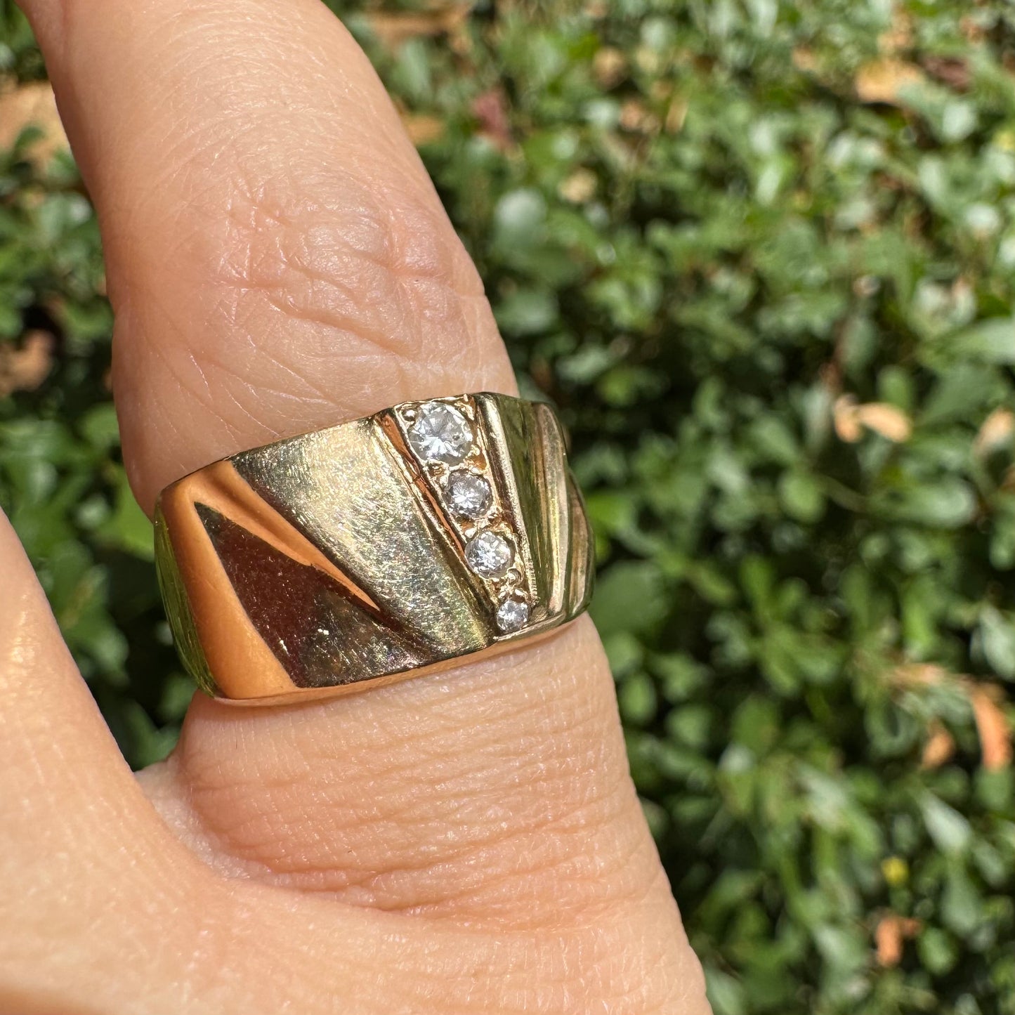 14K gold ring set with Diamonds featuring a fan-like geometric design