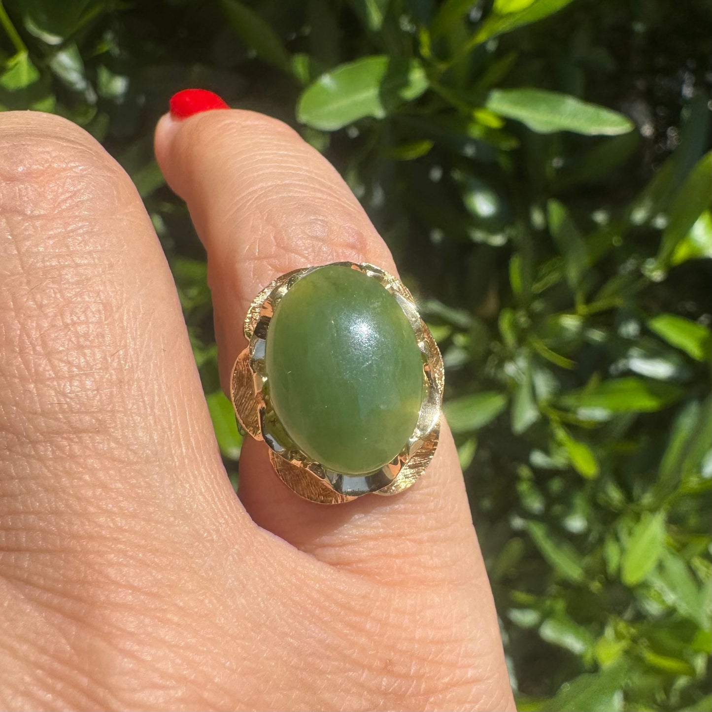 14K gold ring set with a large green Jade cabochon