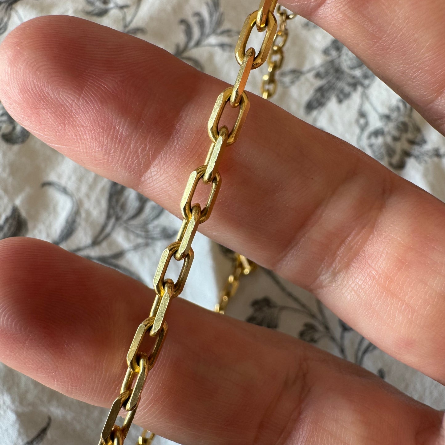 14K gold chain necklace featuring elegant elongated links with a polished finish.