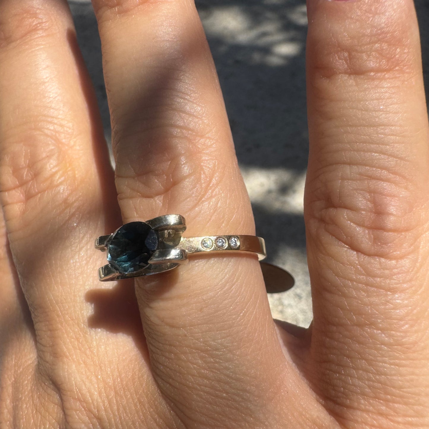 14K gold ring set with an oval-cut Blue Topaz “London”