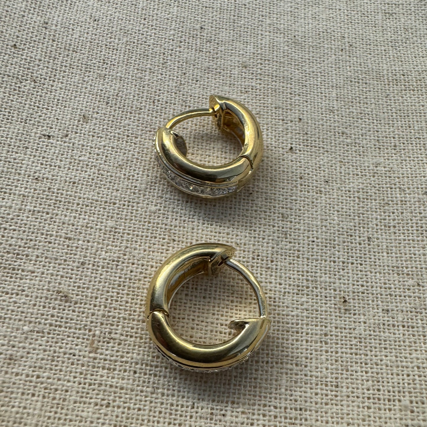 14K gold hoop earrings set with a row of sparkling Diamonds in a sleek channel setting