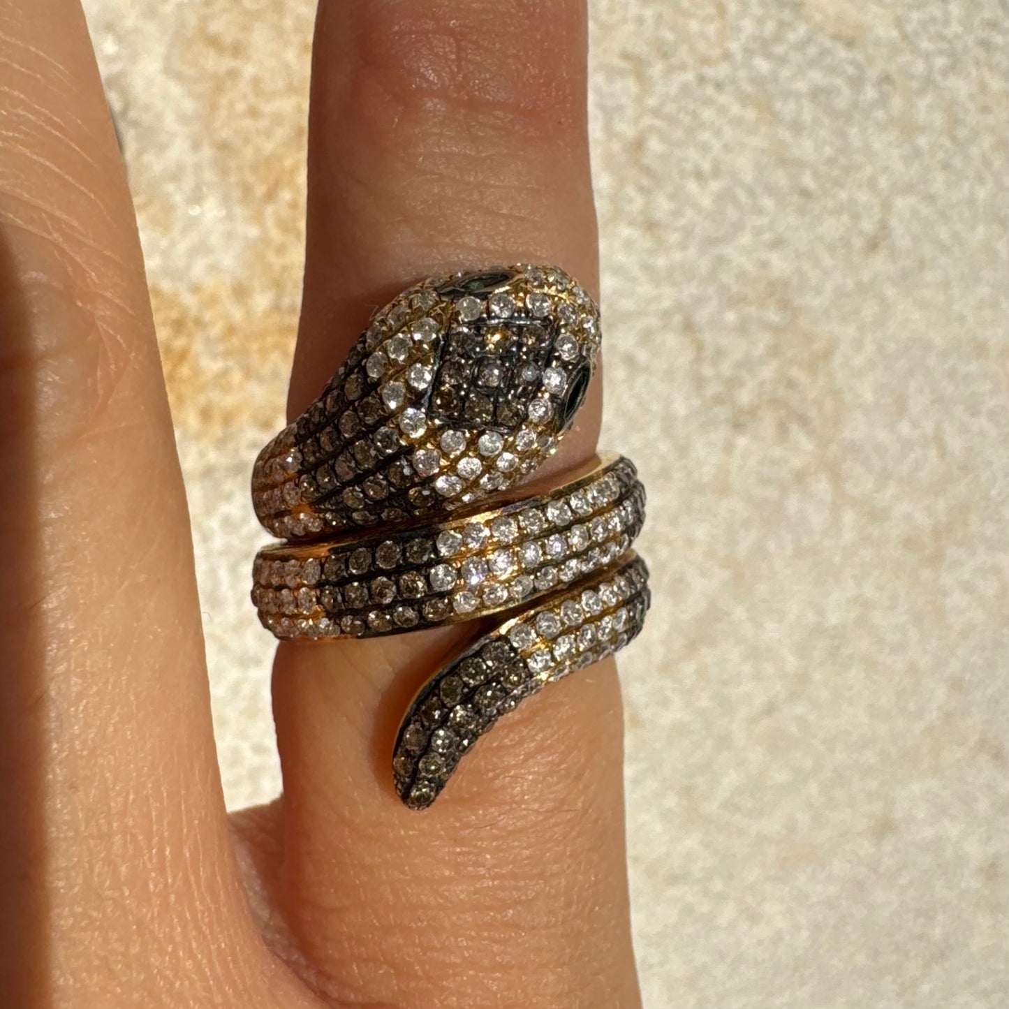 14K gold snake ring fully set with white and black Diamonds, creating a striking contrast and luxurious sparkle.