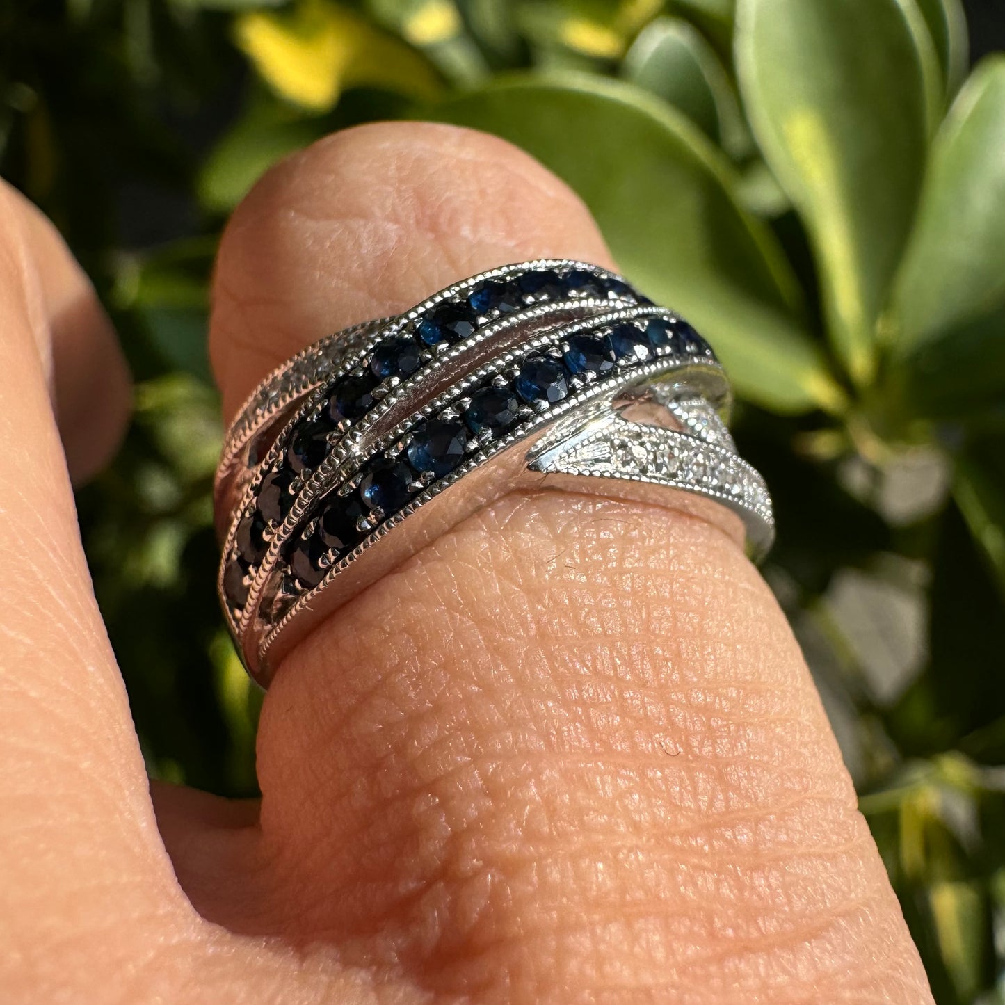 14K gold crossover ring set with Sapphires and sparkling Diamonds