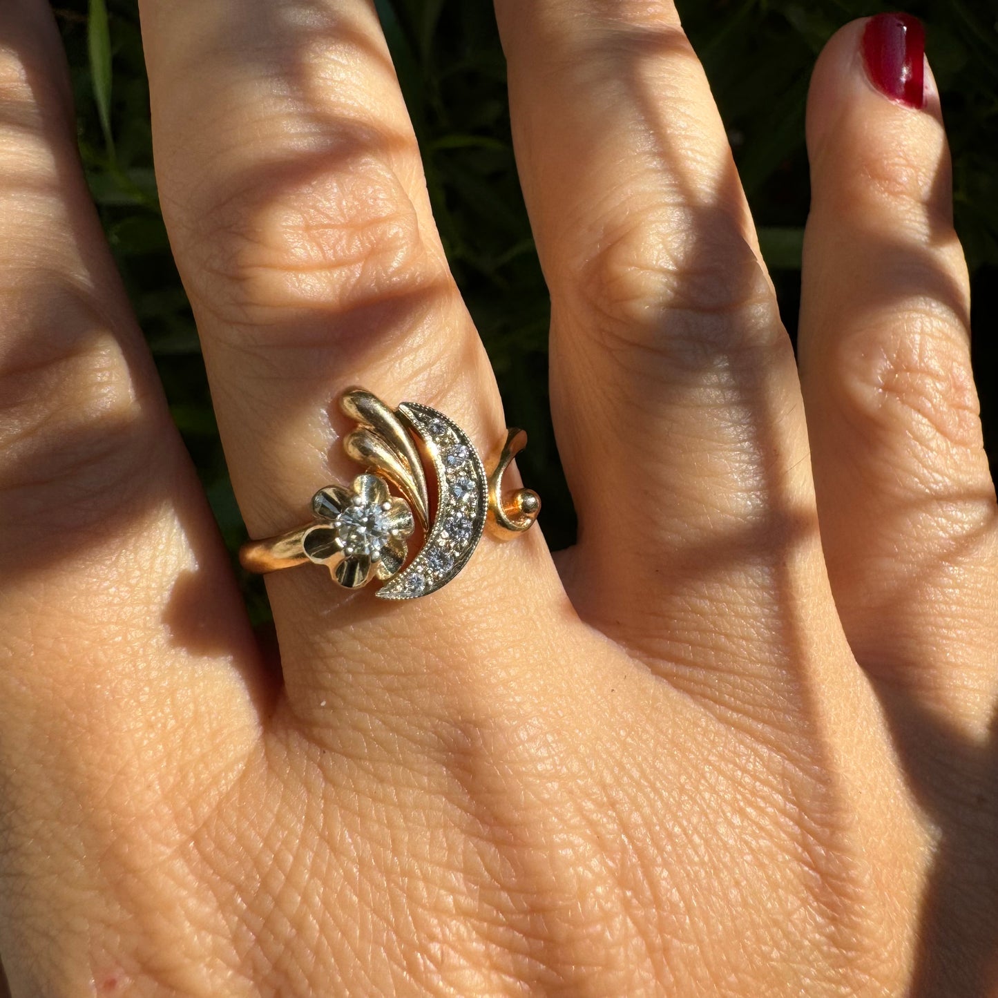 14K gold ring with a delicate moon and star motif set with Diamonds