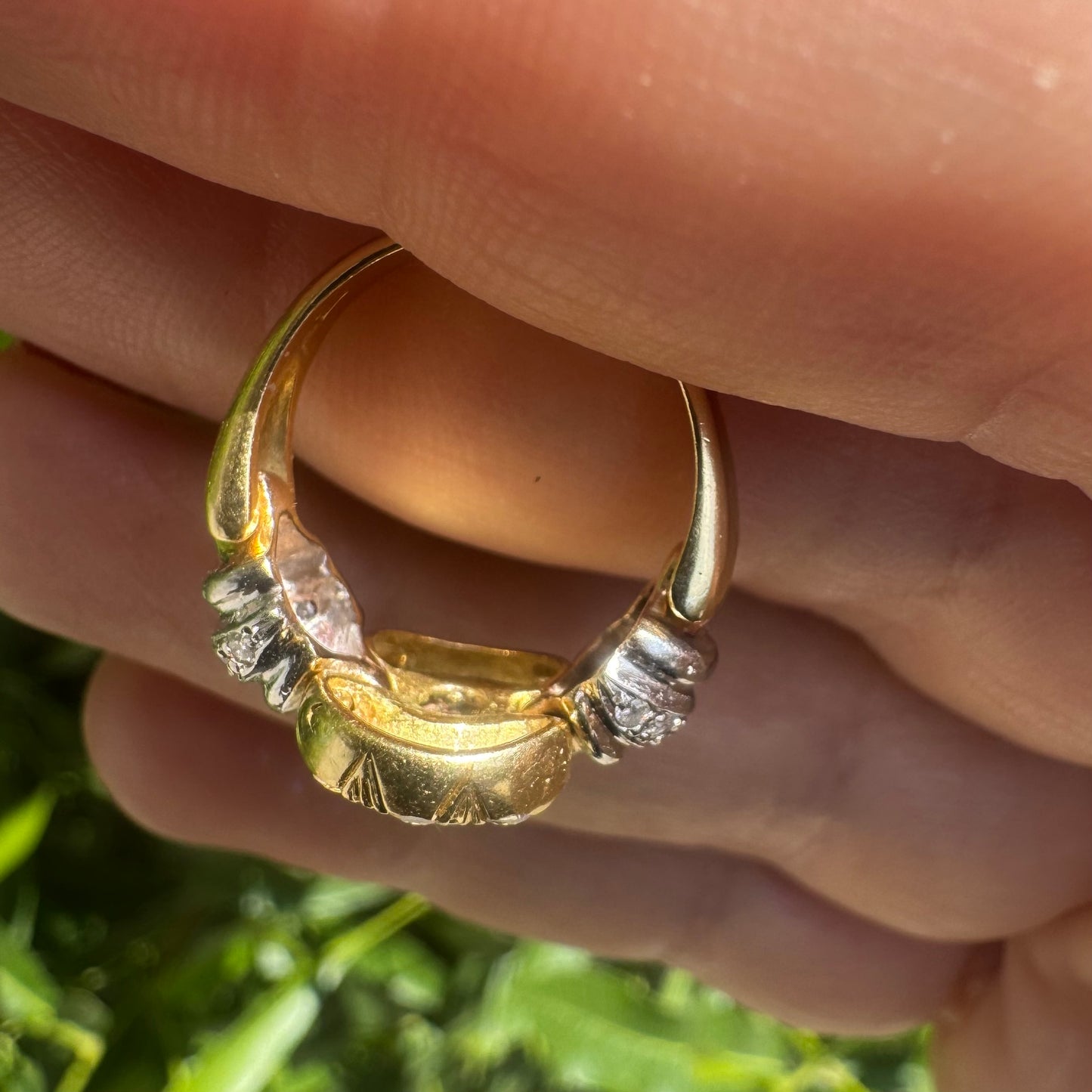 18K two-tone gold ring set with an oval Tanzanite & round brilliant diamonds