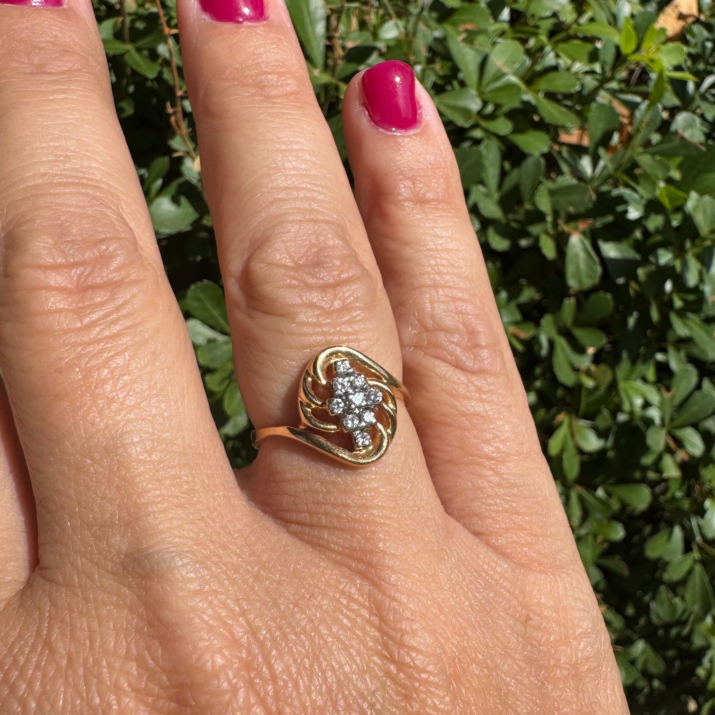 14K gold set with a cluster of sparkling Diamonds at its center