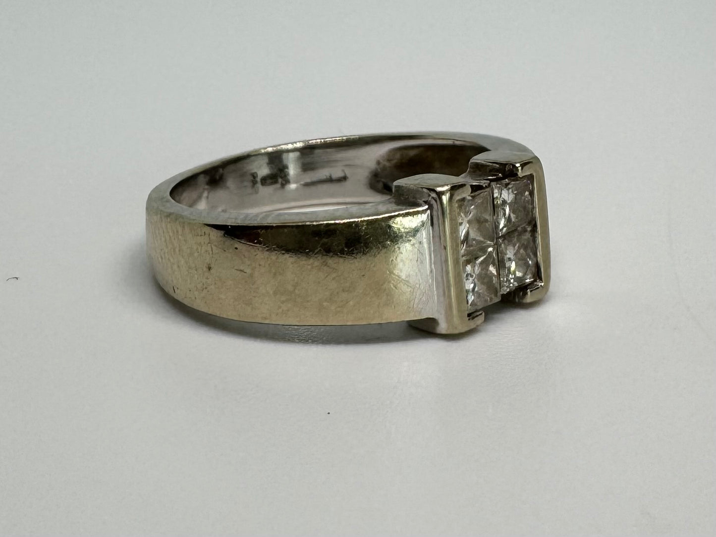 14K gold ring set with 4 square-cut Diamonds