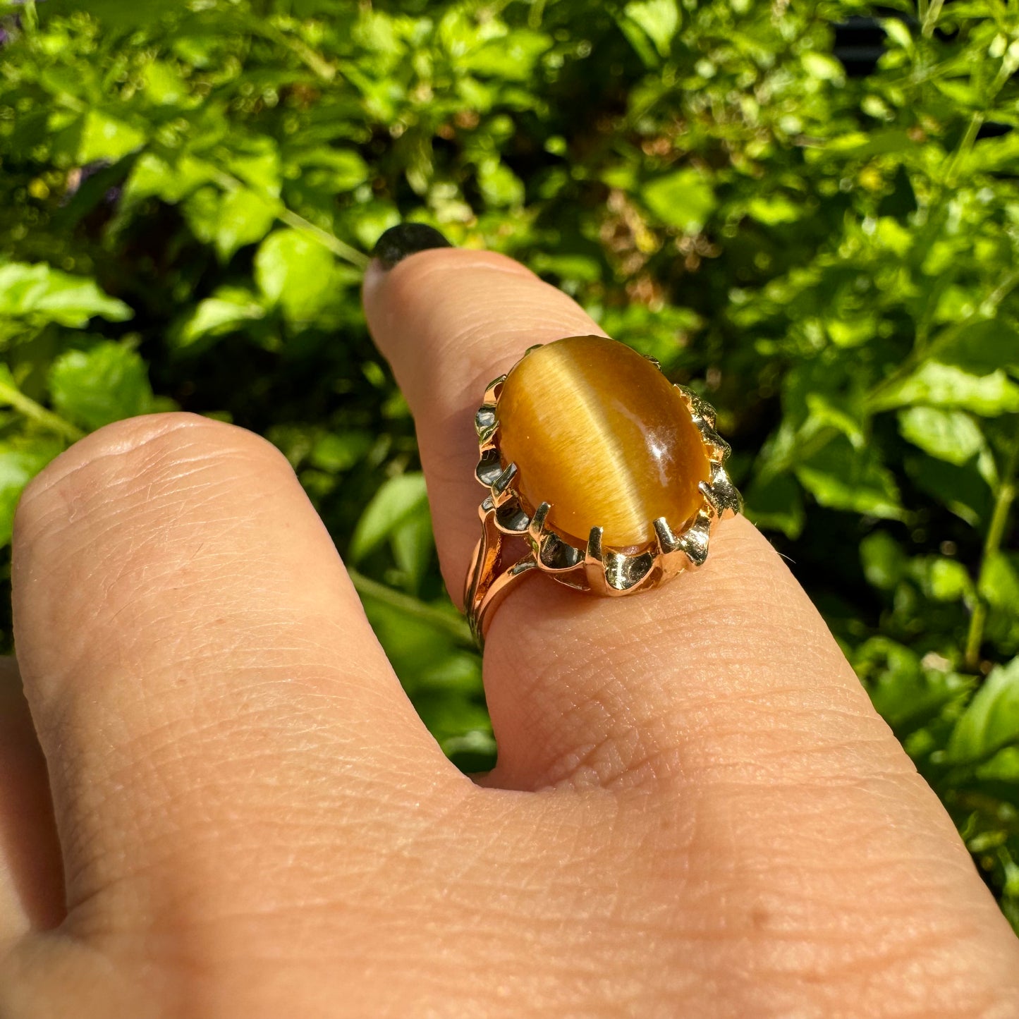 14K gold ring set with a yellow Tiger’s Eye cabochon