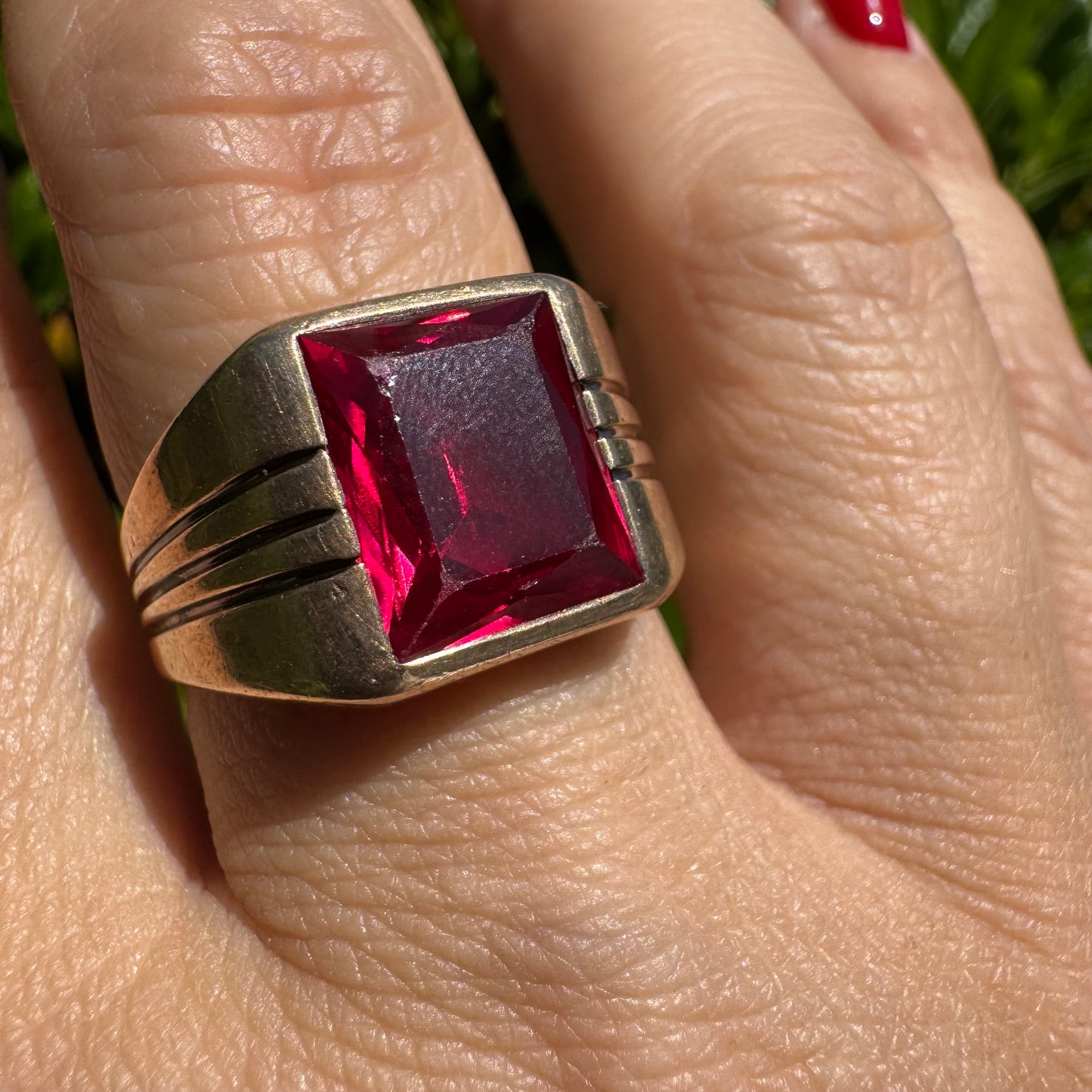 10K gold ring set with a bold red rectangular gemstone