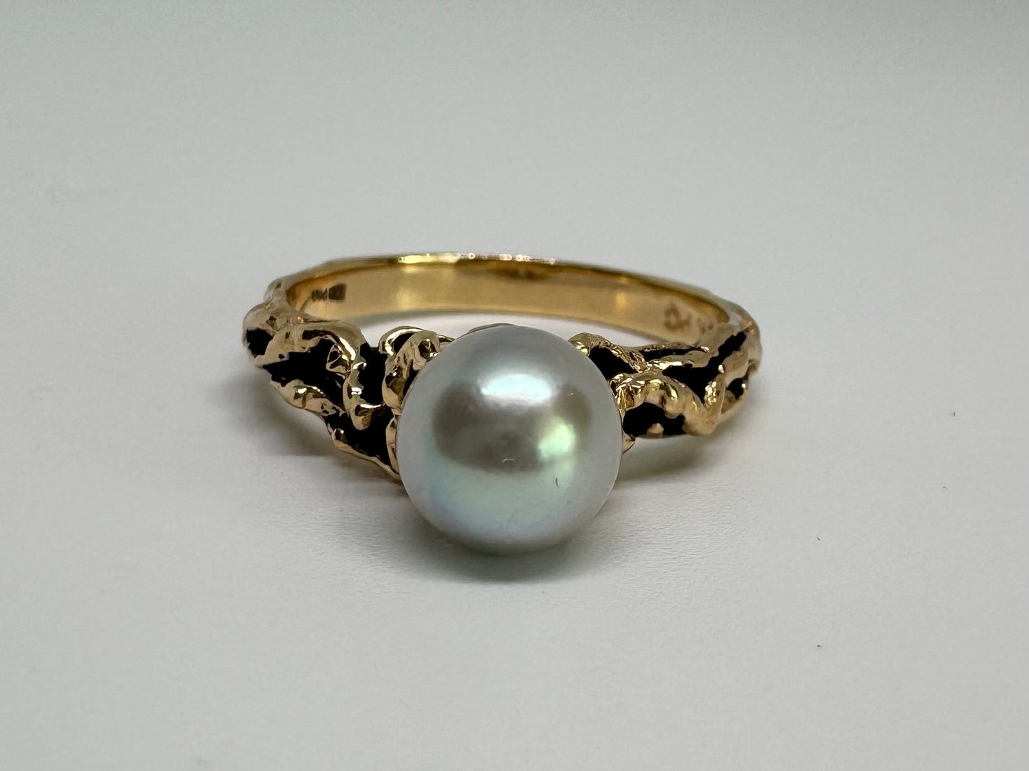 14K gold ring set a luminous white Pearl set on an ornate yellow gold band