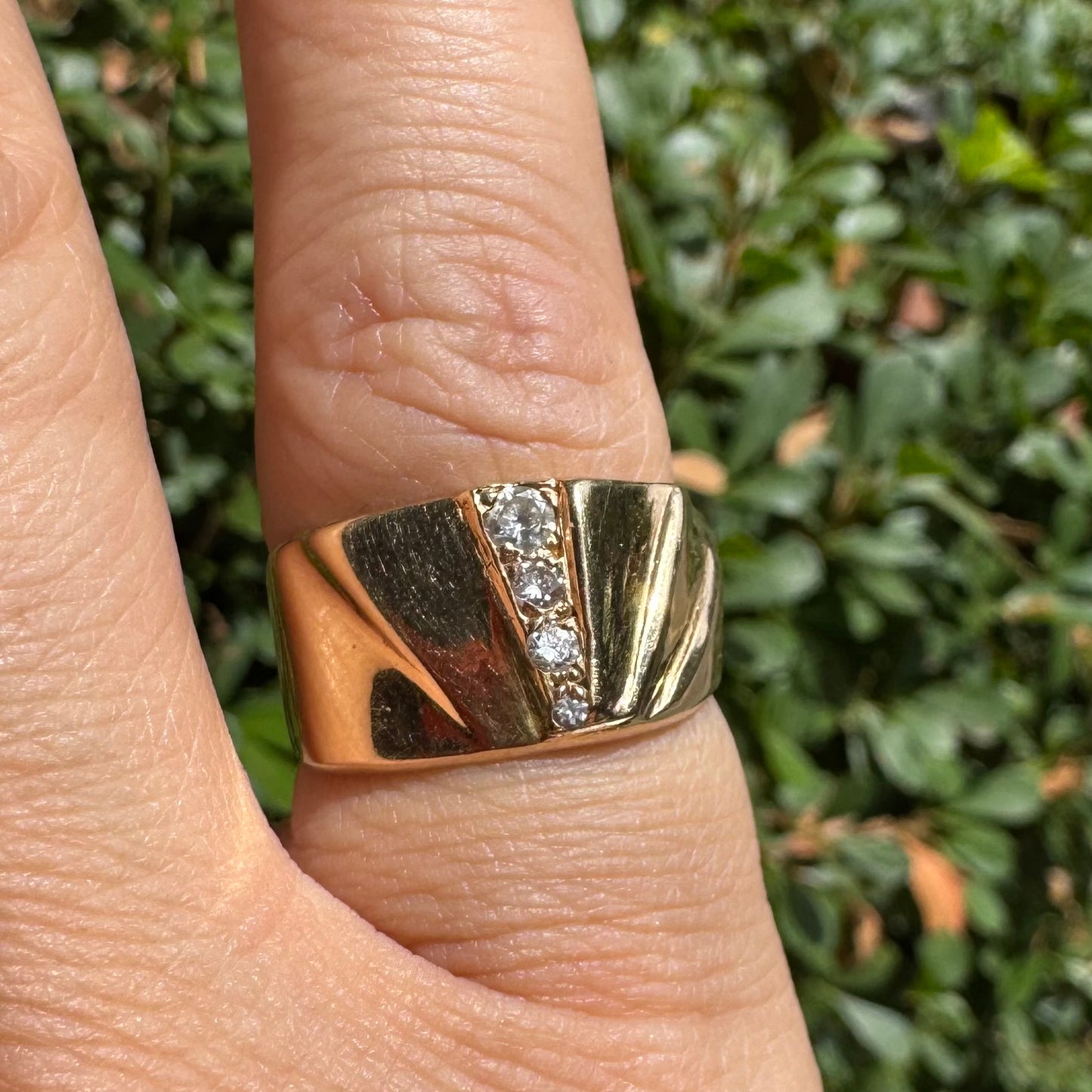 14K gold ring set with Diamonds featuring a fan-like geometric design