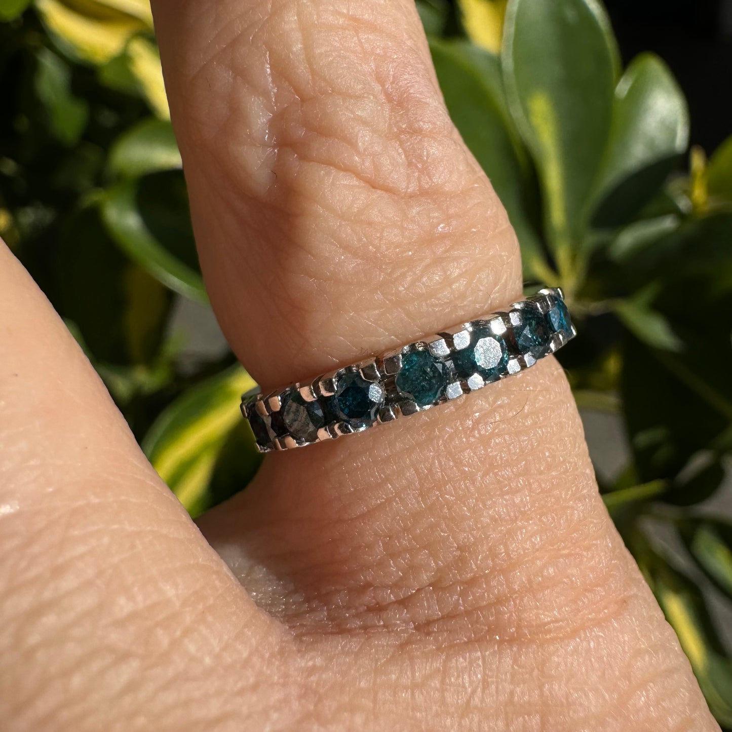 14K gold ring set with blue Diamonds