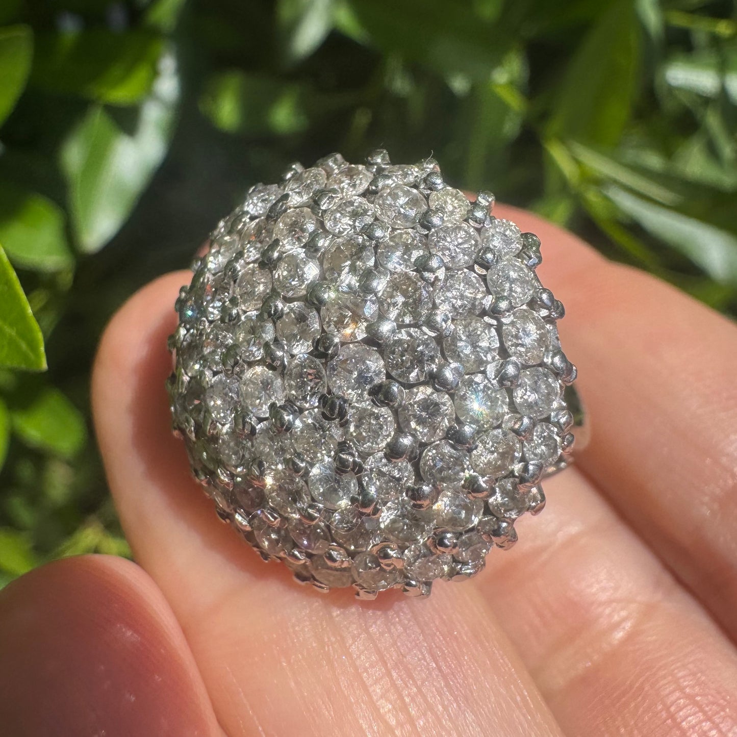 18K gold ring set with Diamonds in a bold pavé setting.