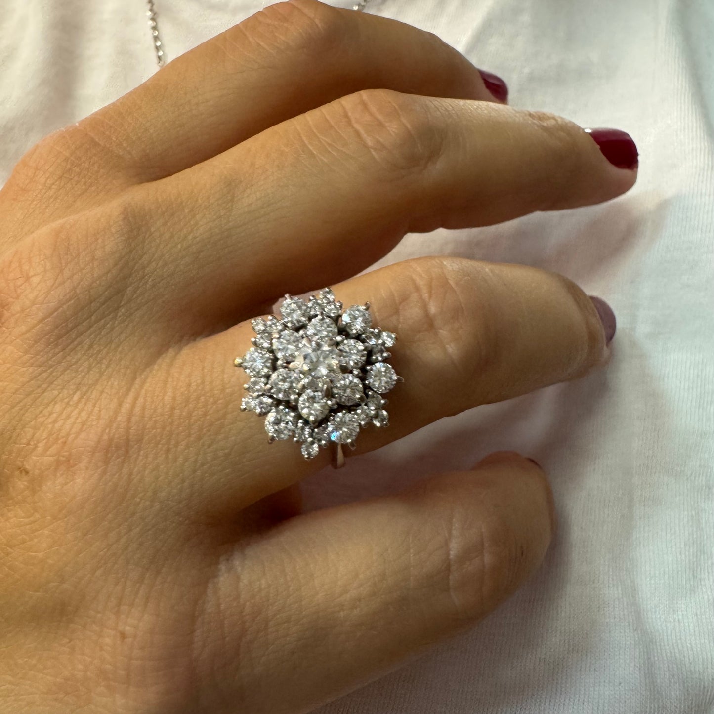 18K gold ring set with sparkling white Diamonds arranged in a floral cluster design