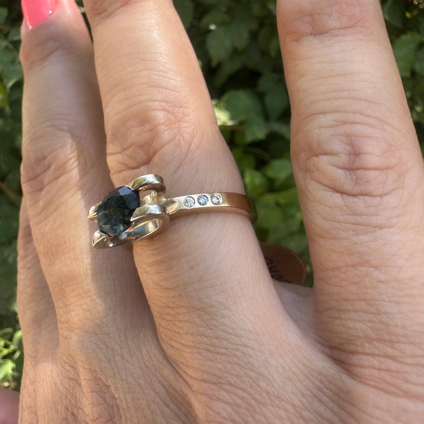 14K gold ring set with an oval-cut Blue Topaz “London”
