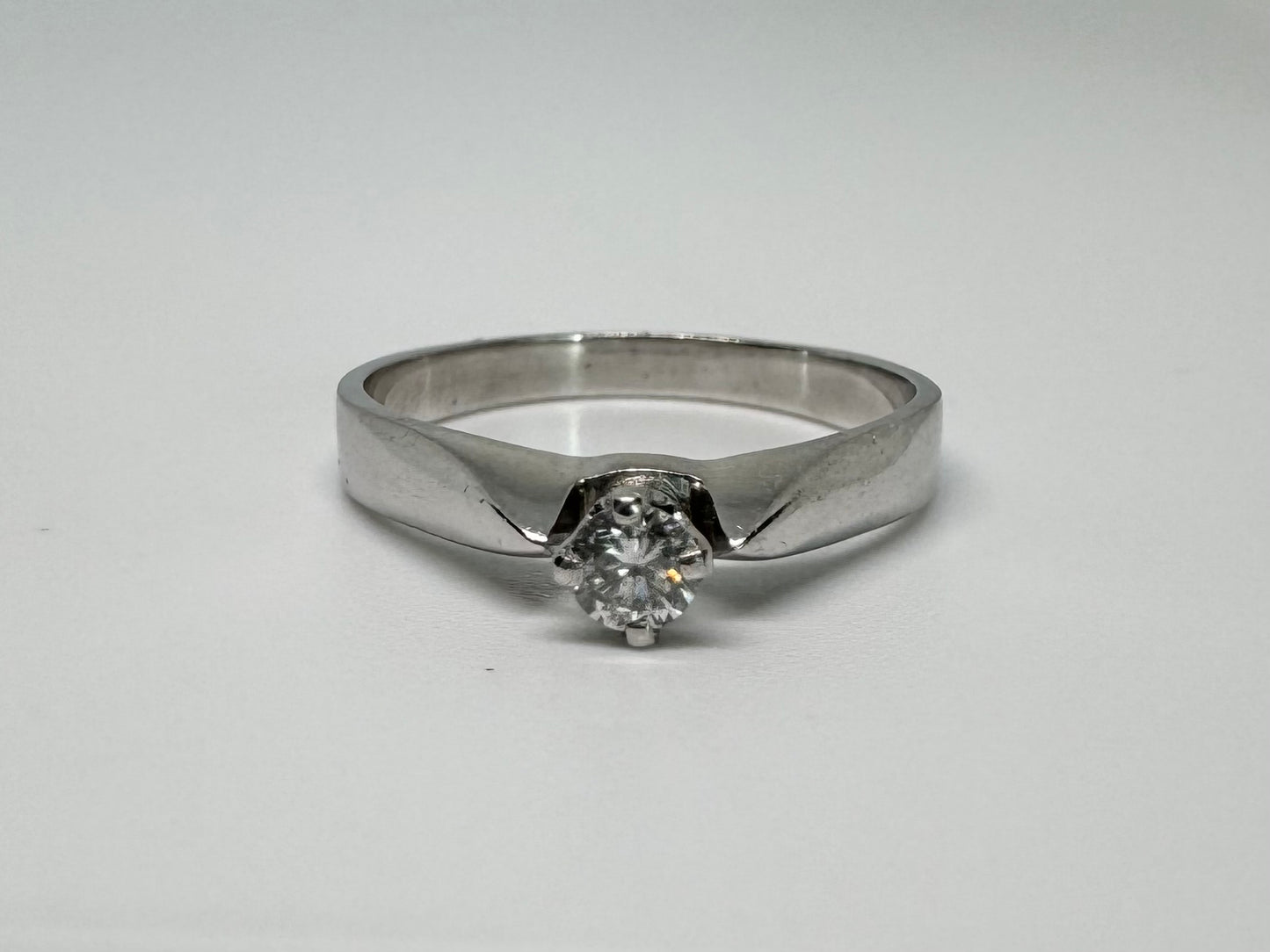 14K gold ring set with one center Diamond