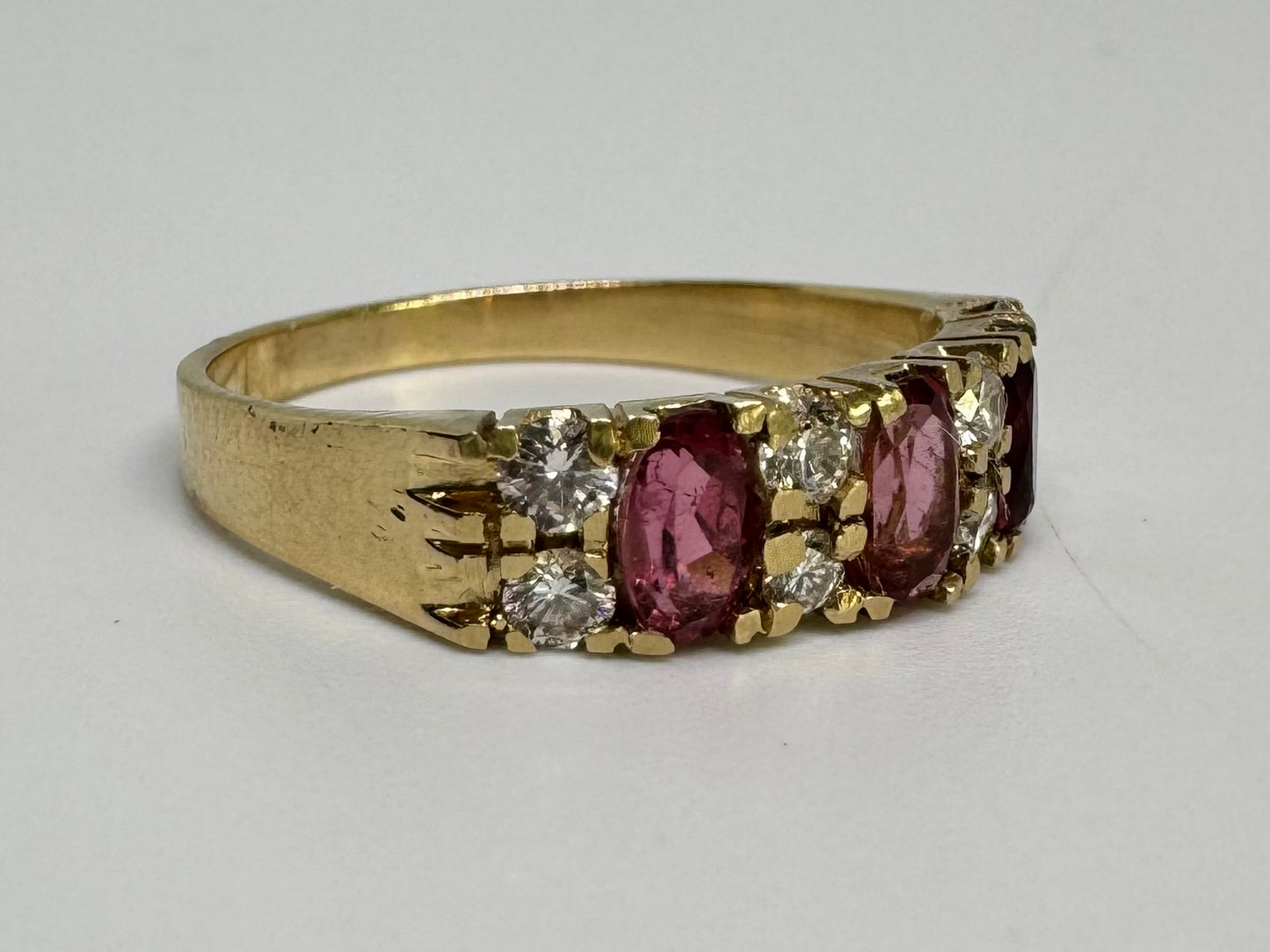 14K gold ring set with oval Pink Tourmalines and round brilliant-cut Diamonds