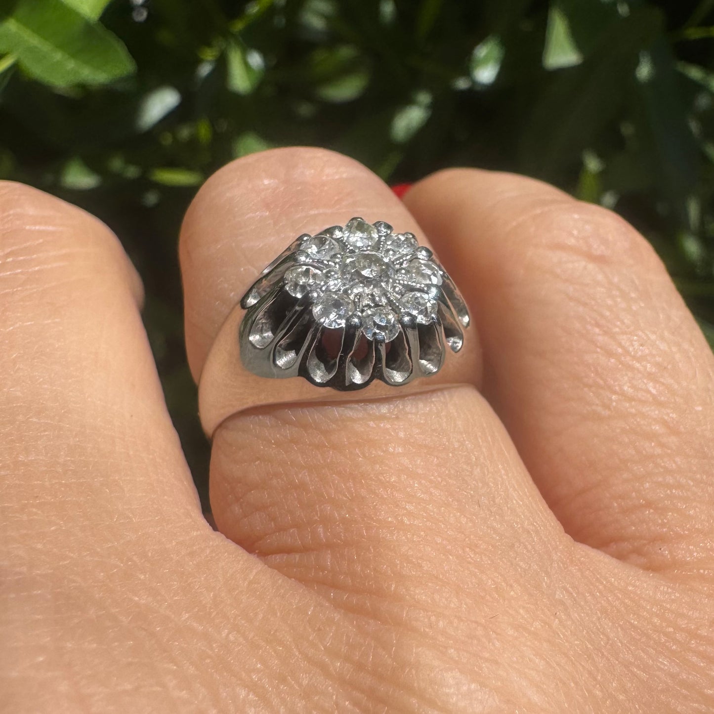 14K gold ring set with a cluster of old cut diamonds arranged in a floral design