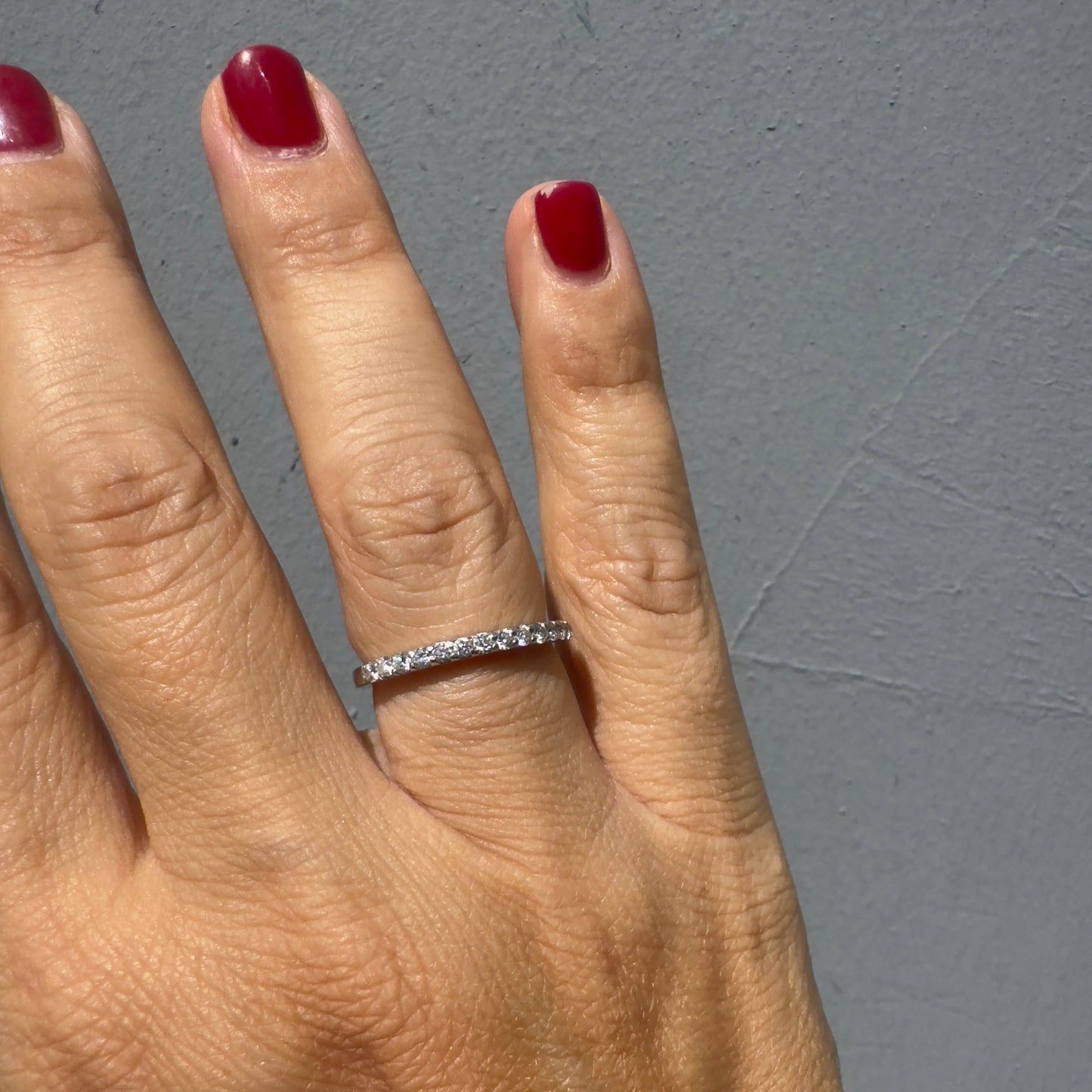 14K gold half-eternity ring set with a row of sparkling round Diamonds.