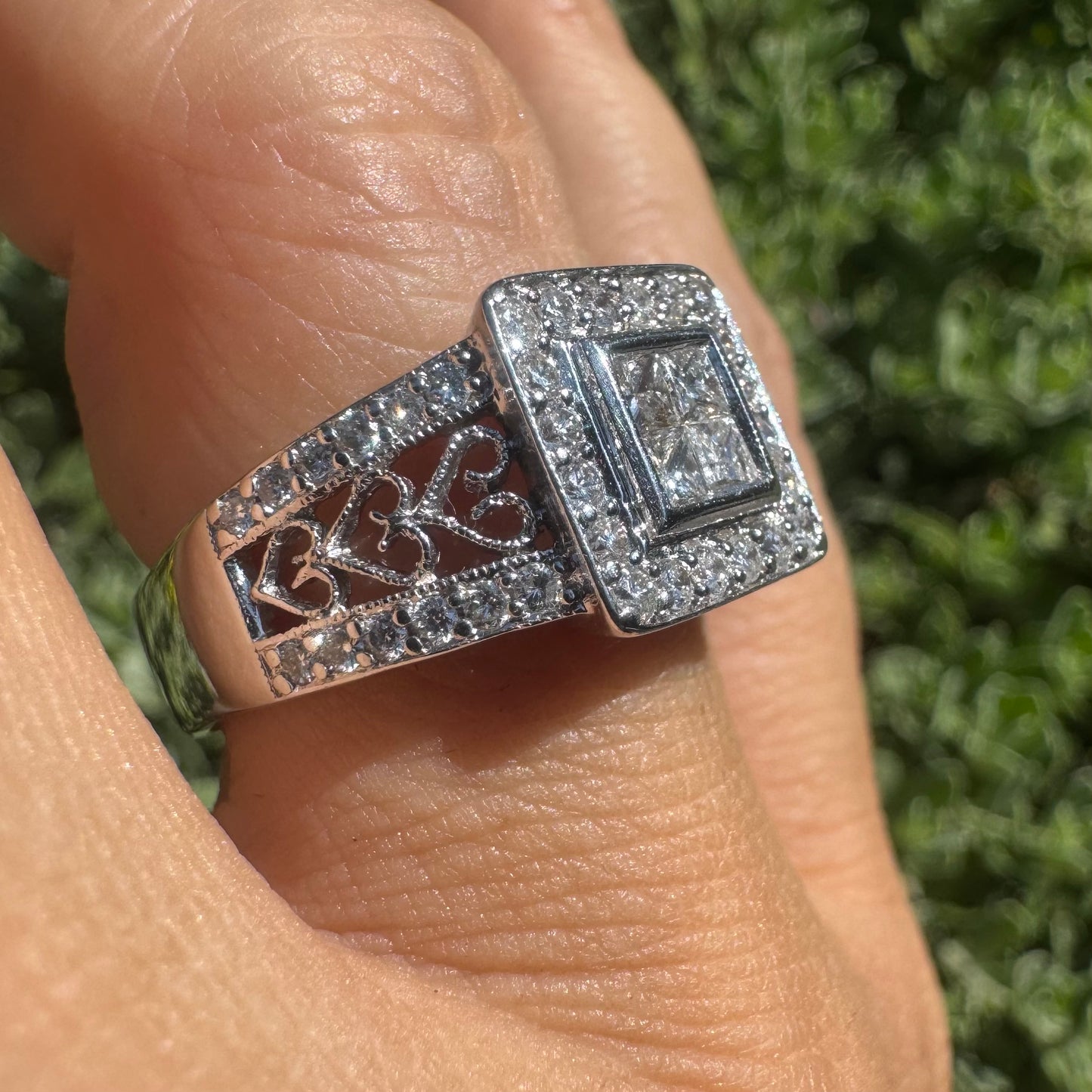 14K gold ring featuring a square cluster of princess-cut Diamonds in the center, surrounded by a double halo of smaller round Diamonds & gold details along the band.