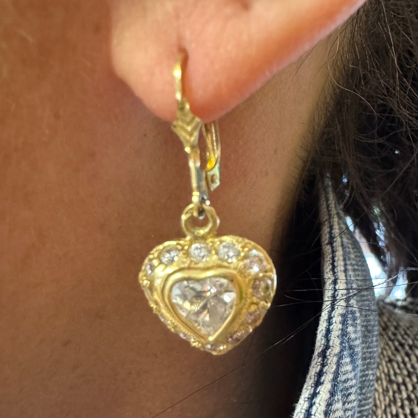 14K gold drop earrings set with a heart-cut central stone & surrounded by a halo of delicate gems.