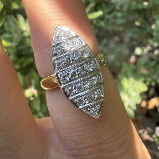 18K gold marquise-shaped ring set with multiple rows of sparkling Diamonds