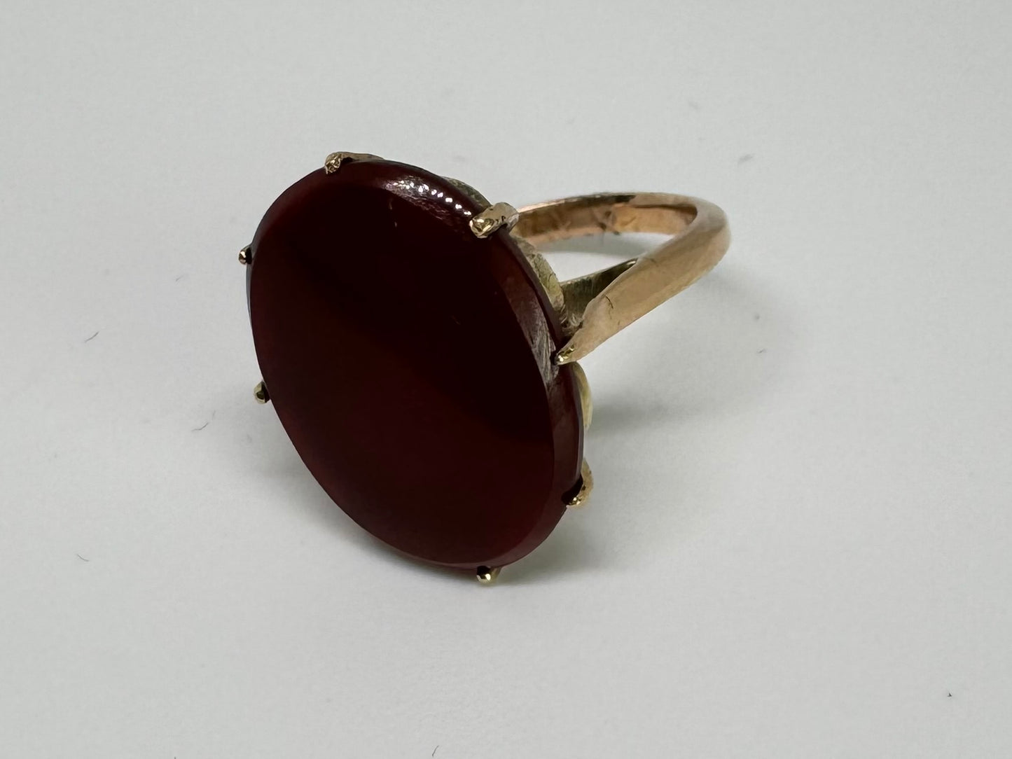 14K gold ring set with a glowing oval Carnelian