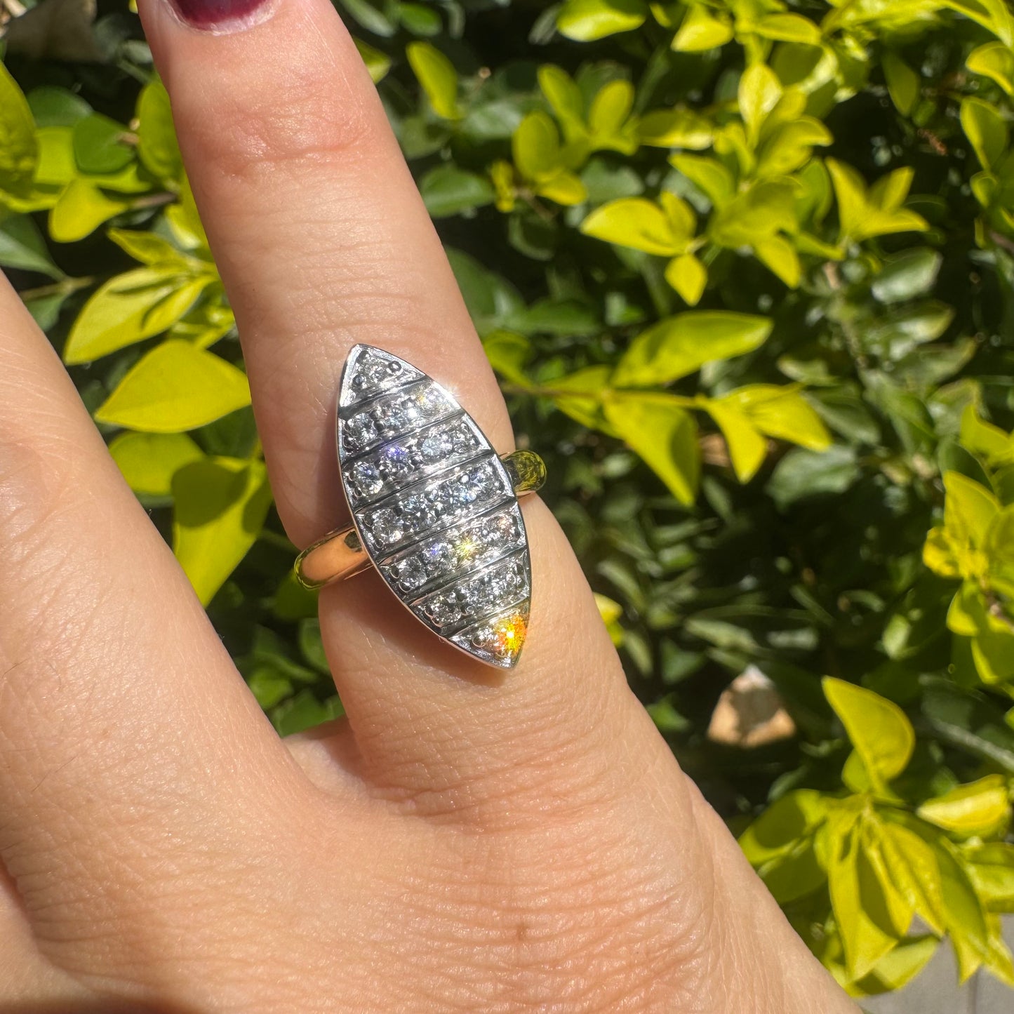 18K gold marquise-shaped ring set with multiple rows of sparkling Diamonds