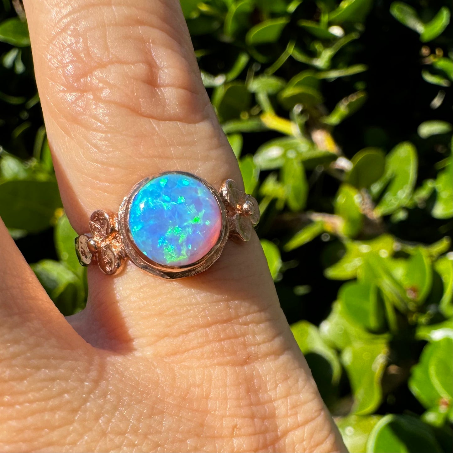 10K gold ring set with round Opal with vibrant flashes of blue, green and white