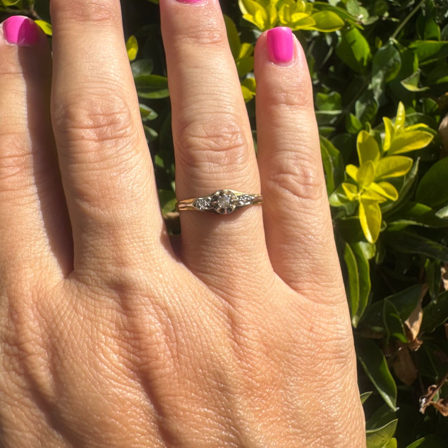 18K gold ring set with an old-cut center Diamond & side Diamonds