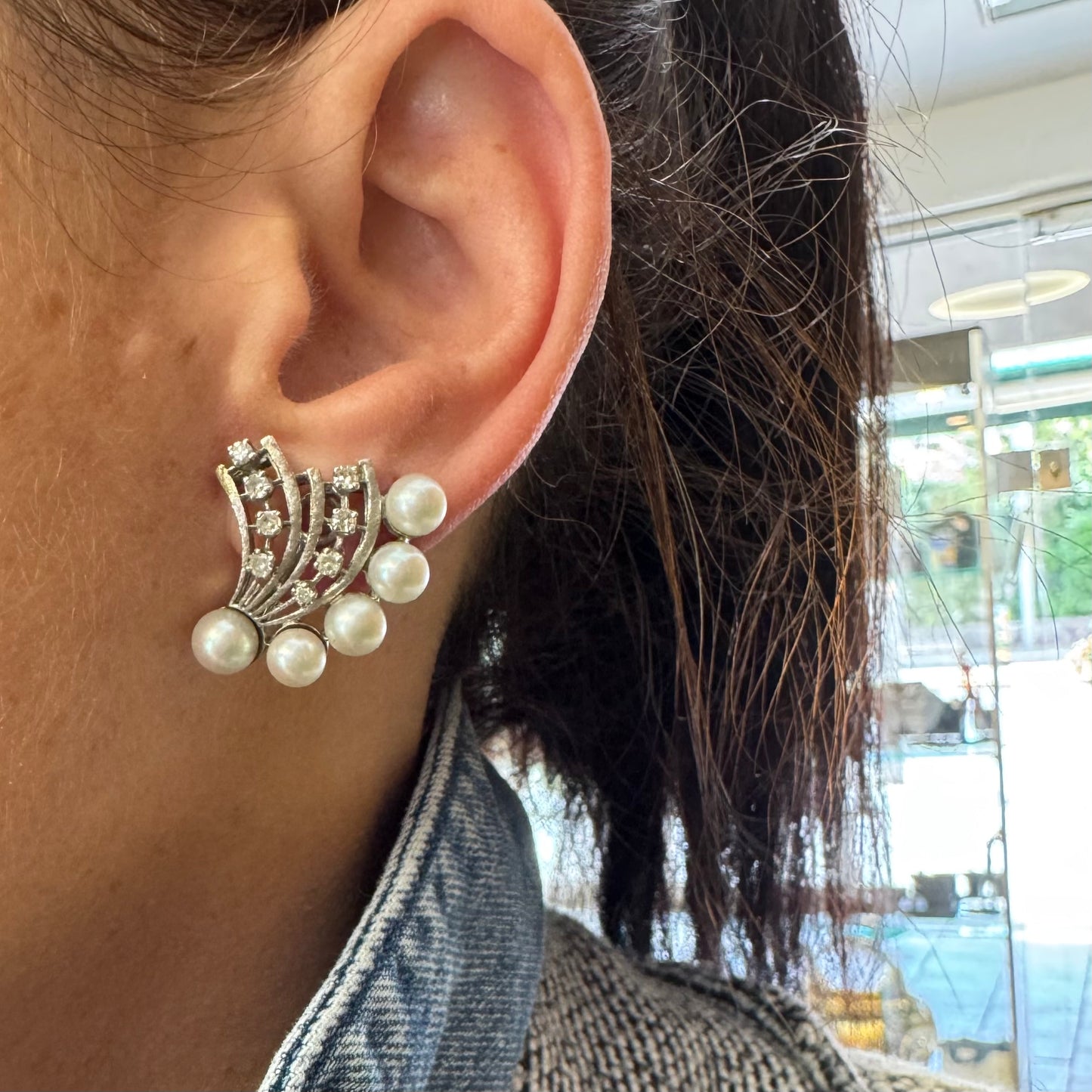 14K gold clip-on earrings inspired by 1950s Hollywood style, set with a row of luminous round pearls & Diamonds