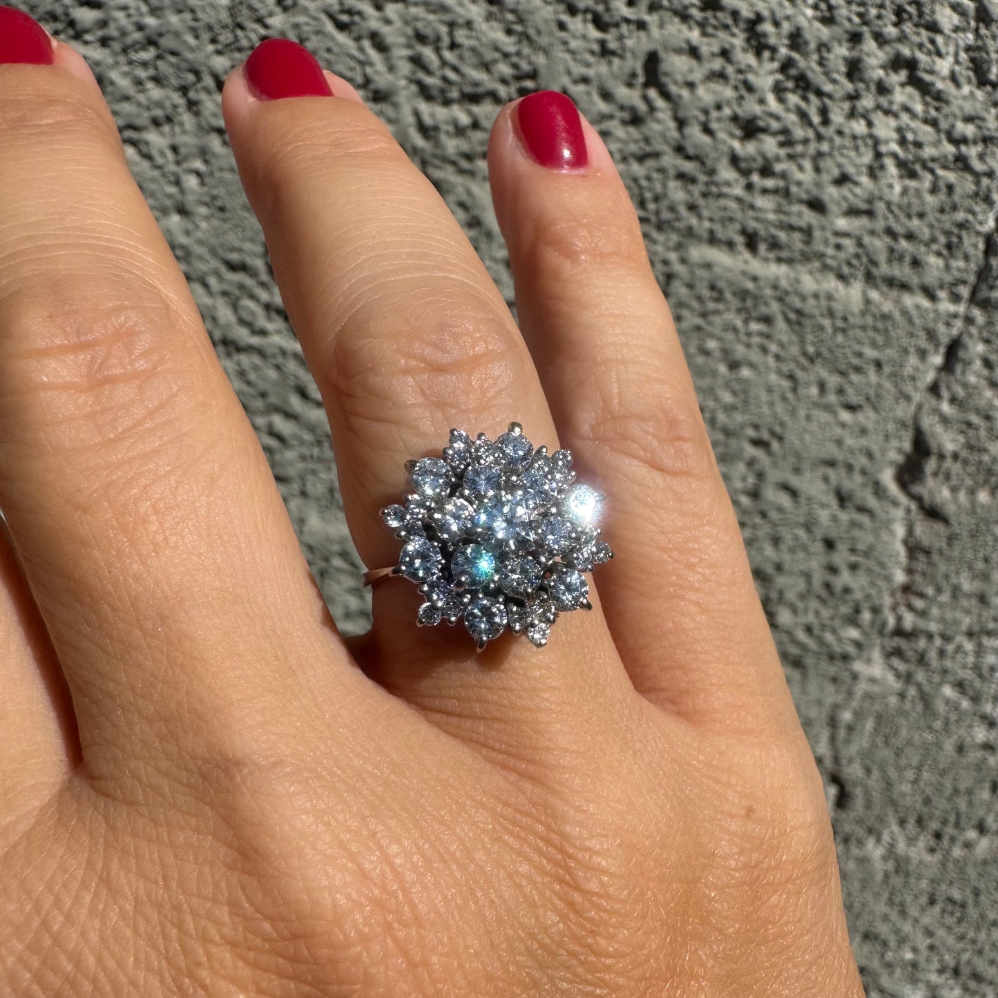 18K gold ring set with sparkling white Diamonds arranged in a floral cluster design
