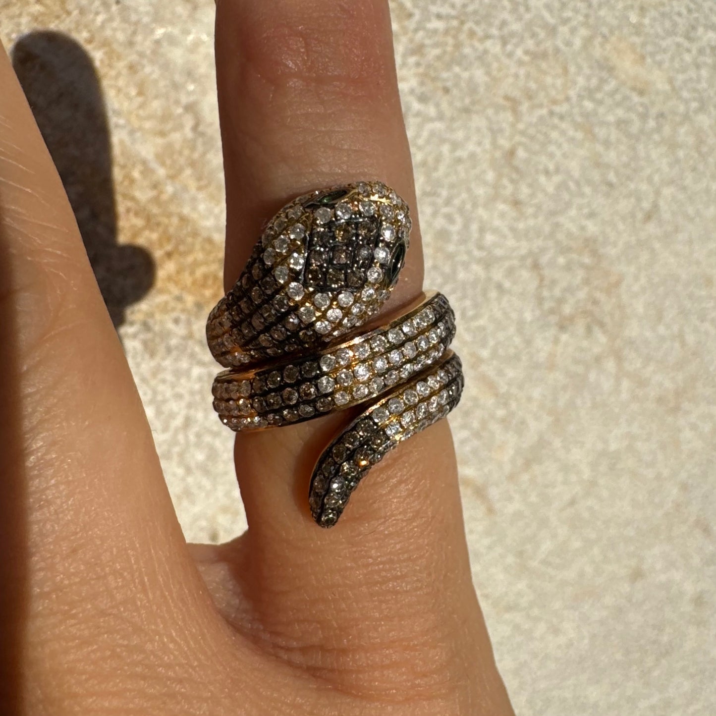 14K gold snake ring fully set with white and black Diamonds, creating a striking contrast and luxurious sparkle.