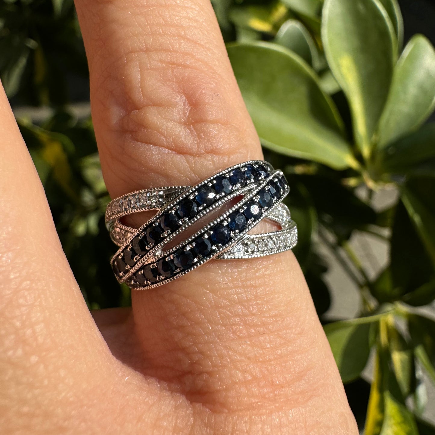 14K gold crossover ring set with Sapphires and sparkling Diamonds