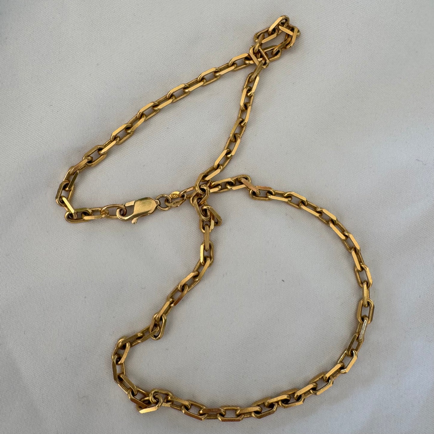 14K gold chain necklace featuring elegant elongated links with a polished finish.