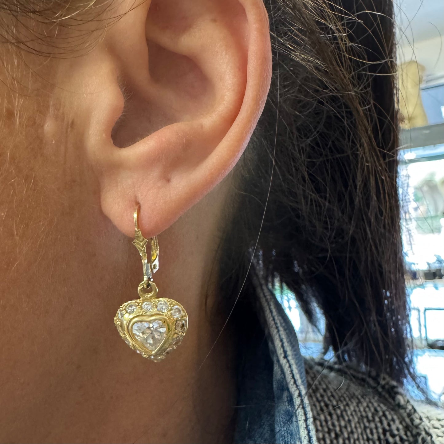 14K gold drop earrings set with a heart-cut central stone & surrounded by a halo of delicate gems.