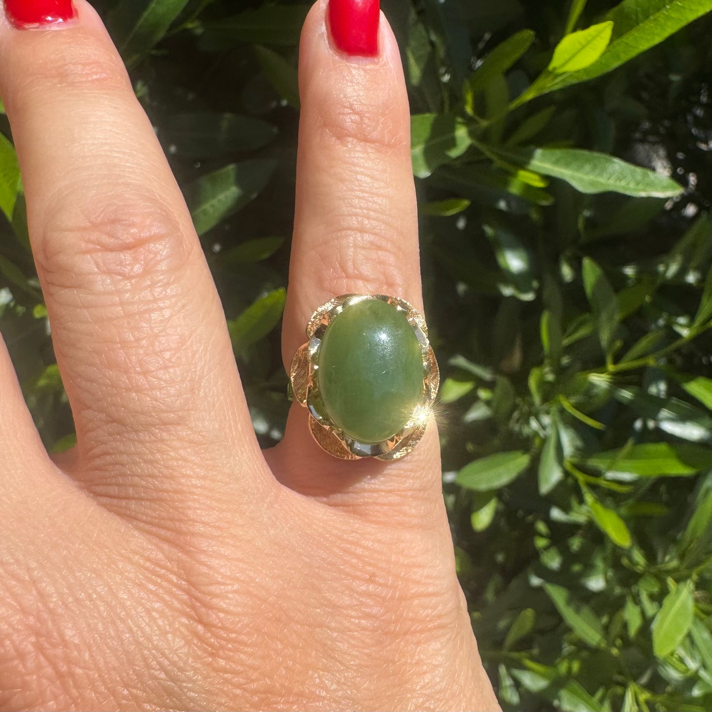 14K gold ring set with a large green Jade cabochon